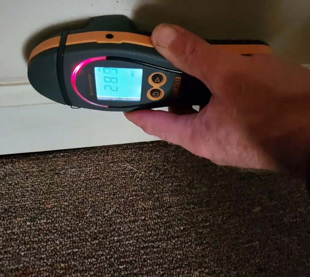 Moisture detection at baseboard during Storm Damage Restoration in Cedarburg